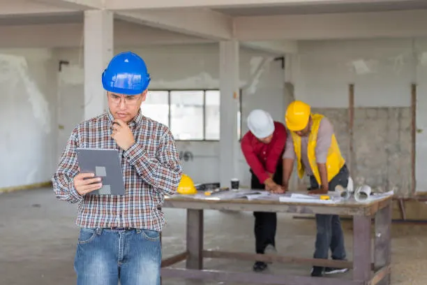 Construction estimator preparing detailed estimates and quantity takeoffs